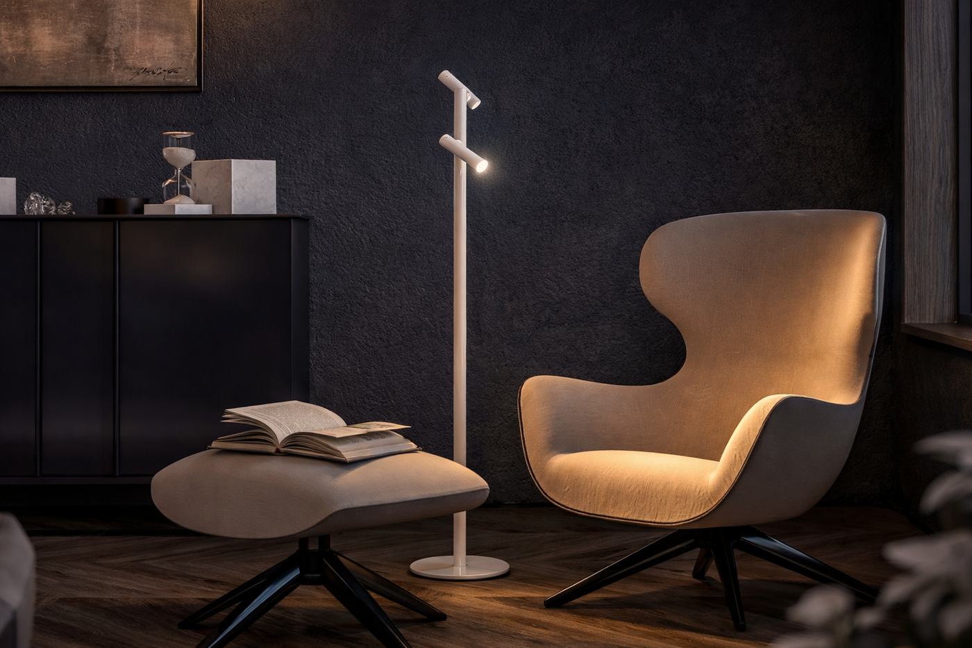 Sompex Tubo wireless floor lamp standing next to a lounge chair in a modern dark-walled room.