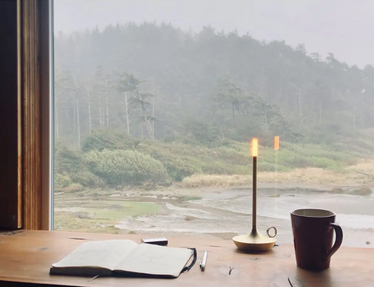 Graypants Wick portable lamp sits on a narrow console table, showcasing its sturdy base and slim profile that make it ideal for hallway lighting and tight spaces.