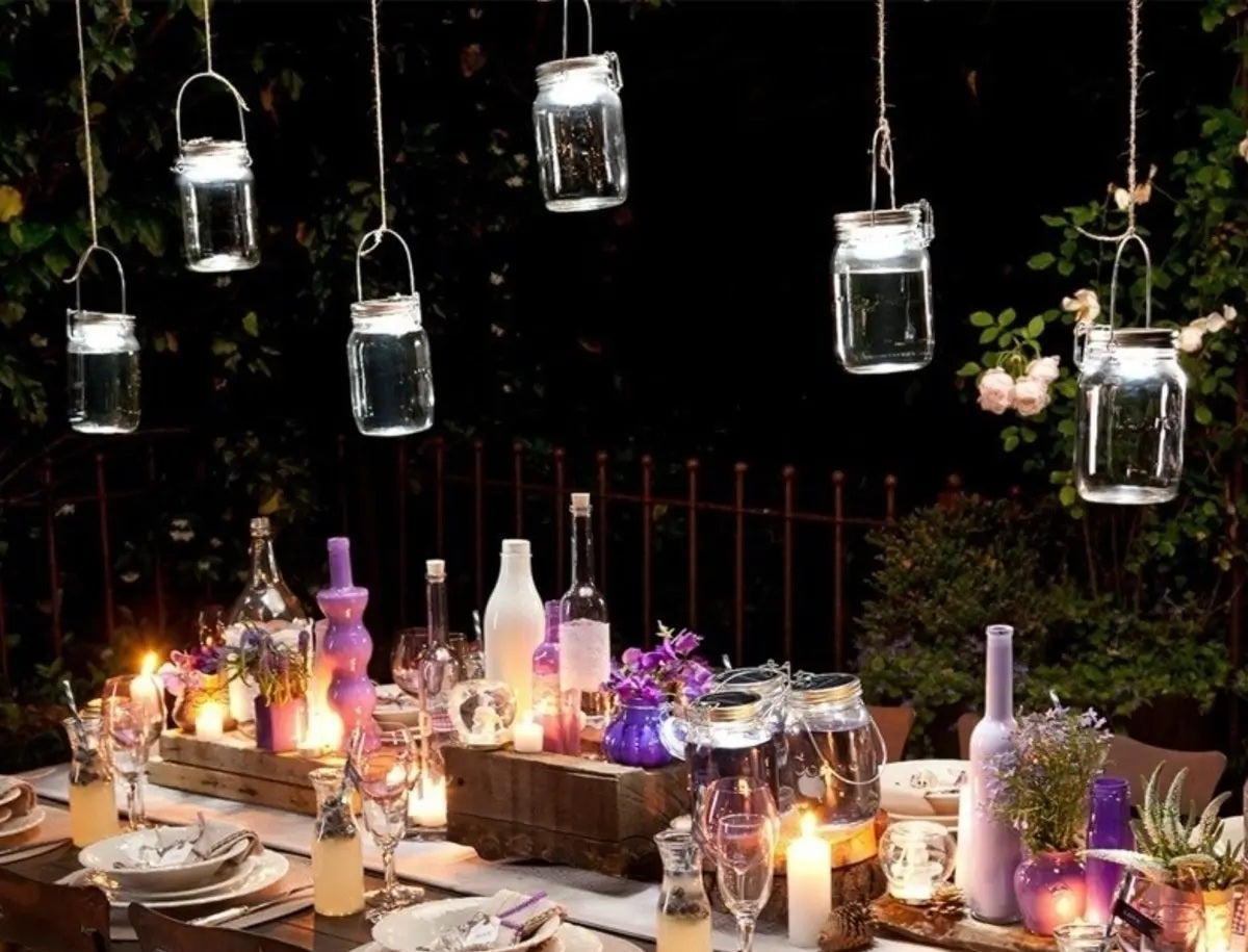 Ramadan lights and decorations: Sonnenglas Solar Jar lantern to illuminate alfresco dining table setup.